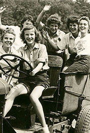 Bunch of farmgirls waving, having fun on a tractor - Official Roster